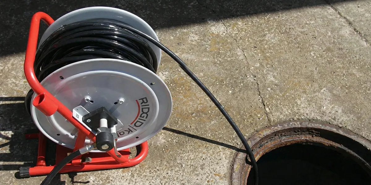 sewer rodding equipment prepared to clear clogged sewer lines in Boulder, CO