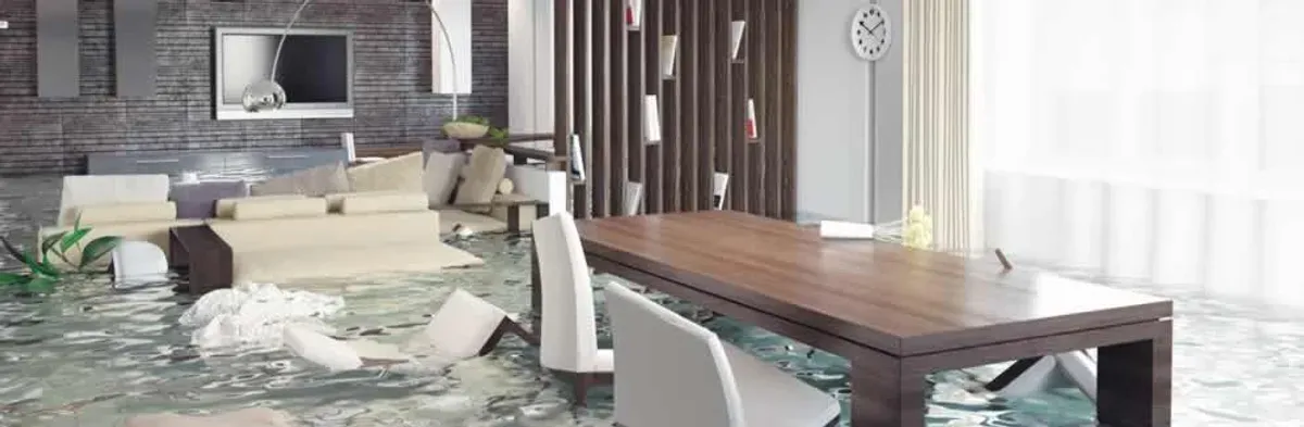 home interior affected by water damage with flooded floors and displaced furniture in Boulder, CO
